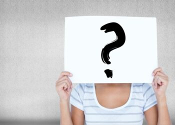 woman with a sign in the face with a question mark