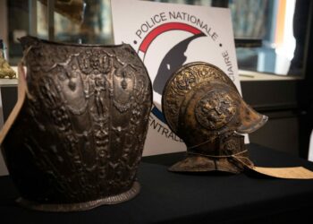 This picture taken on March 3, 2021, shows a breastplate and a ceremonial helmet during their official restitutions by the French Central Directorate of the Judicial Police (DCPJ) to the Louvre Museum, in Paris. A breastplate and a ceremonial helmet, two "exceptional" objects from the Italian Renaissance, were handed over by the police to the Louvre museum after being found in Bordeaux during an auction linked to an estate. These objects, which belonged to the collection of the Baroness de Rothschild, had been donated to the Louvre in 1922 and stolen in 1983. Estimations say they worth around 500,000 euros.,Image: 594904961, License: Rights-managed, Restrictions: , Model Release: no