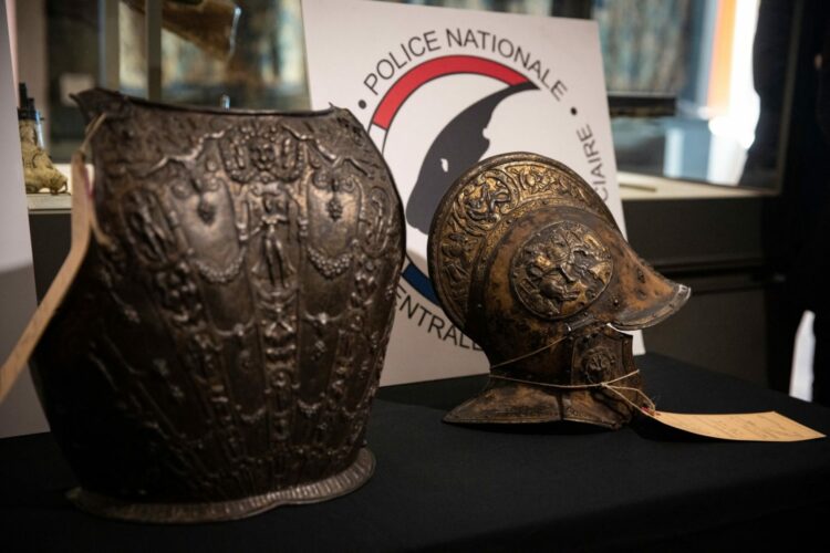 This picture taken on March 3, 2021, shows a breastplate and a ceremonial helmet during their official restitutions by the French Central Directorate of the Judicial Police (DCPJ) to the Louvre Museum, in Paris. A breastplate and a ceremonial helmet, two "exceptional" objects from the Italian Renaissance, were handed over by the police to the Louvre museum after being found in Bordeaux during an auction linked to an estate. These objects, which belonged to the collection of the Baroness de Rothschild, had been donated to the Louvre in 1922 and stolen in 1983. Estimations say they worth around 500,000 euros.,Image: 594904961, License: Rights-managed, Restrictions: , Model Release: no